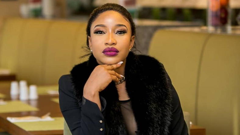 Tonto Dikeh wearing black with her arms under her chin