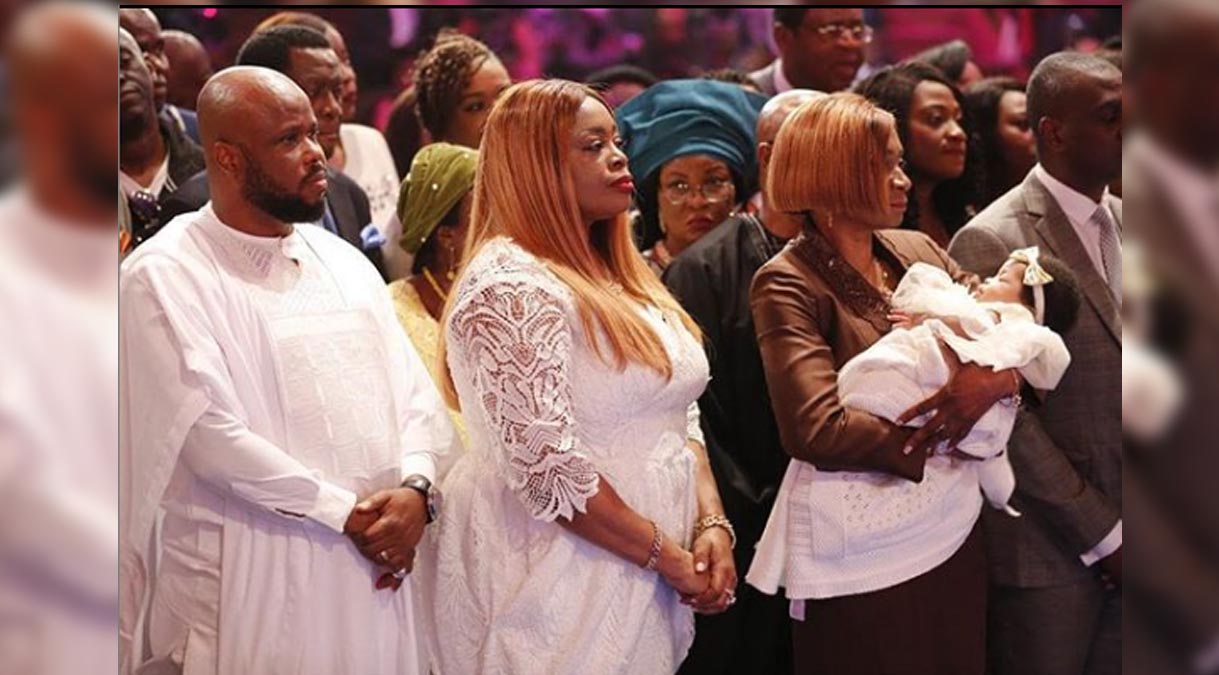 Sinach and her husband and child